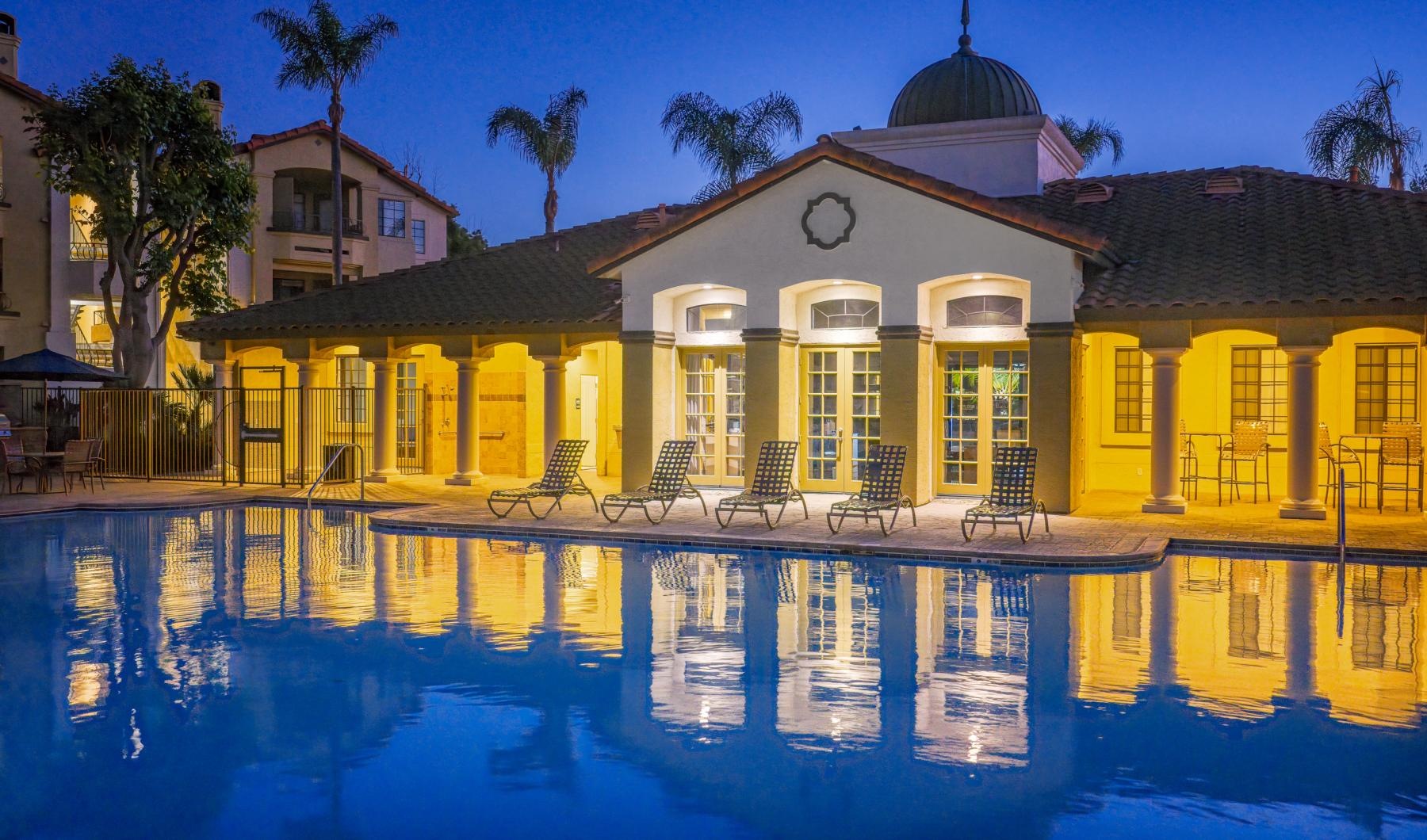 Resort-style swimming pool with lounge seating