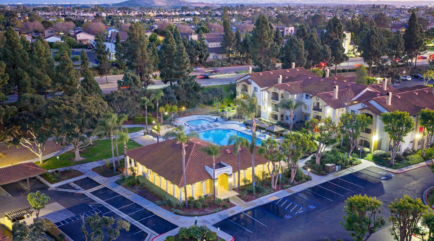 an aerial of a pool and many buildings