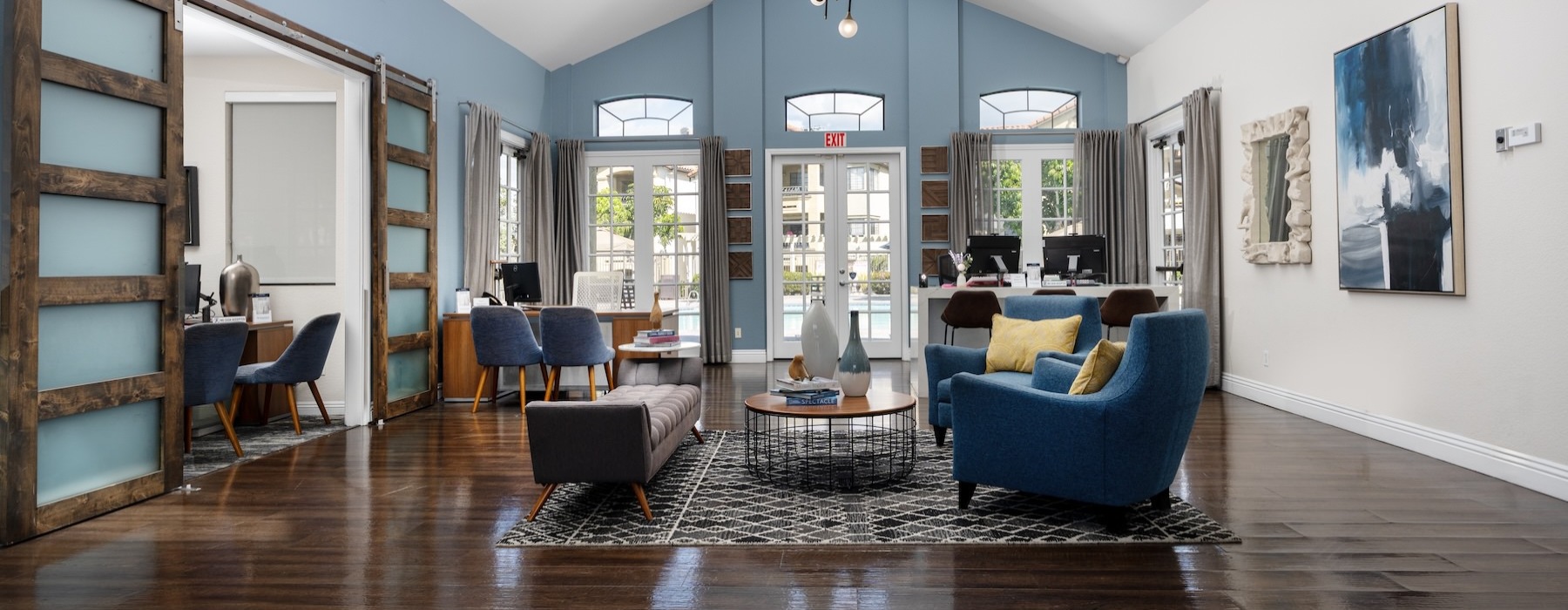 a leasing office with tables and chairs