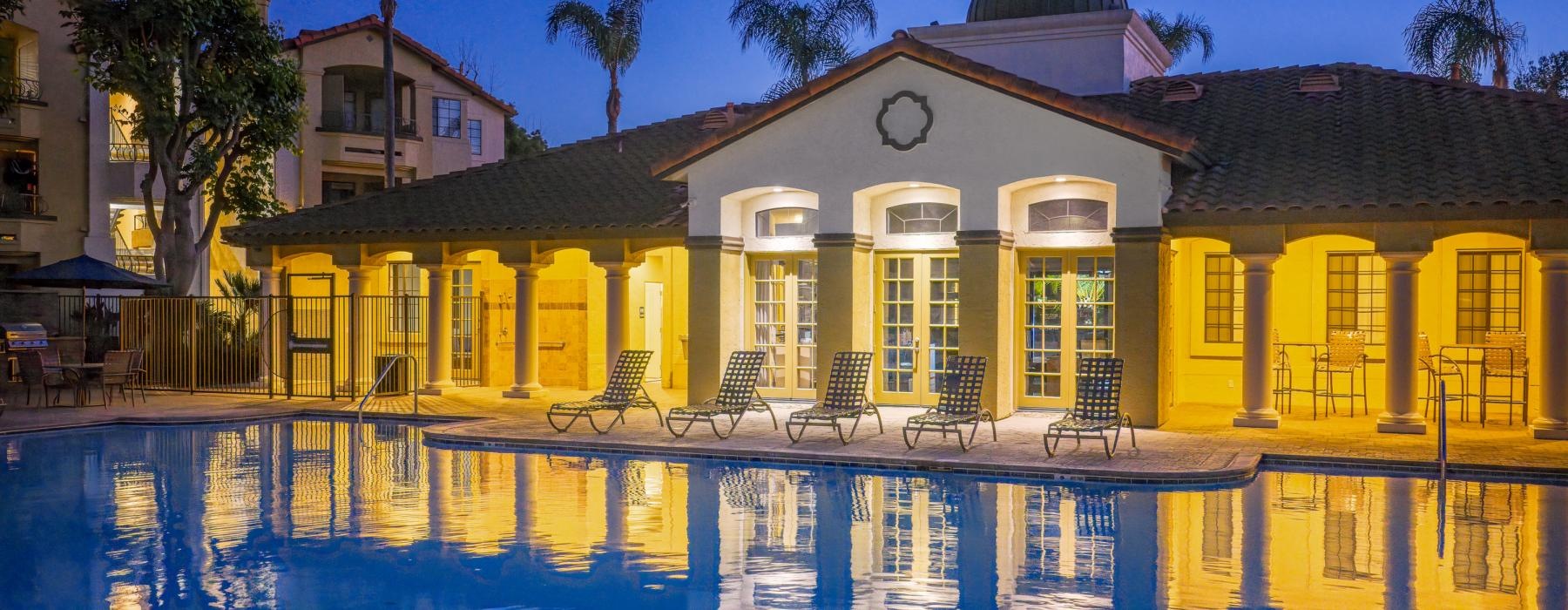 Resort-style swimming pool with lounge seating