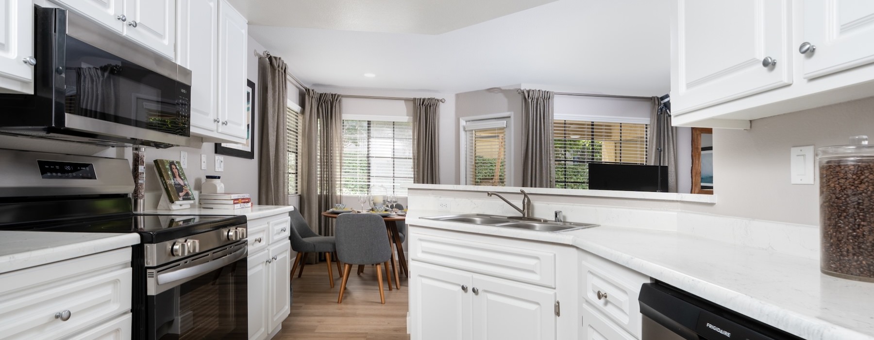 a kitchen with white cabinets