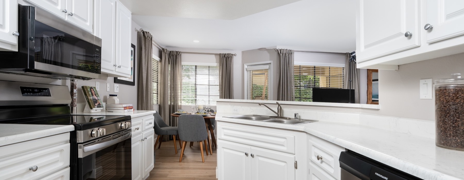 a kitchen with white cabinets