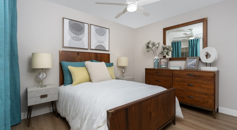 a bedroom with a bed and two nightstands