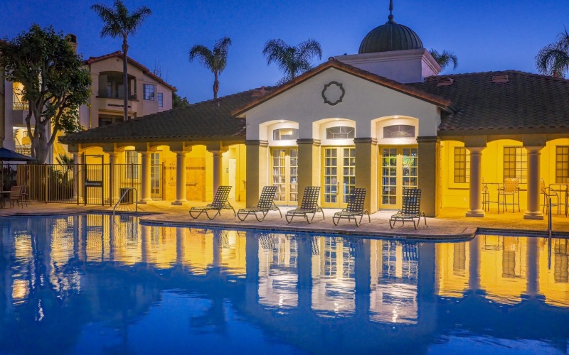 a swimming pool in front of a building