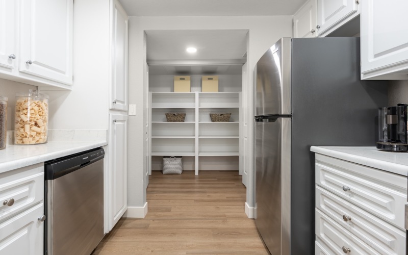 a kitchen with white cabinets